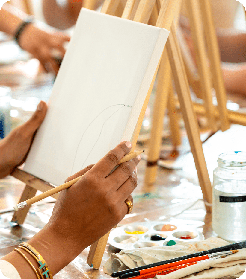 Person painting on a canvas