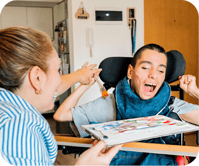 Caregiver celebrating with wheelchair user