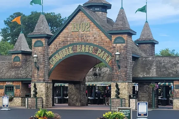 Canobie Lake Park entrance with stone archway and flags