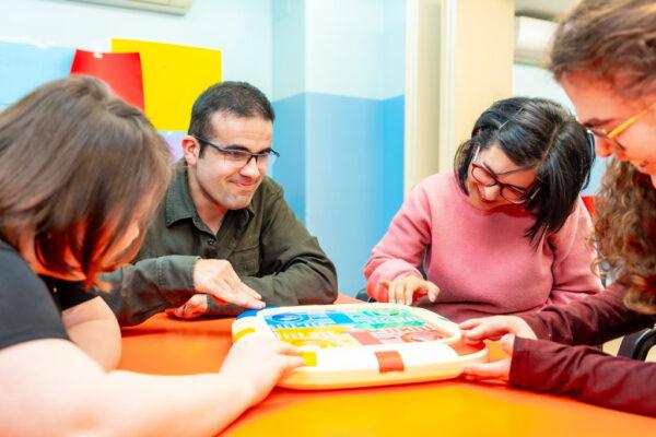 Group participating in a board game and lunch activity