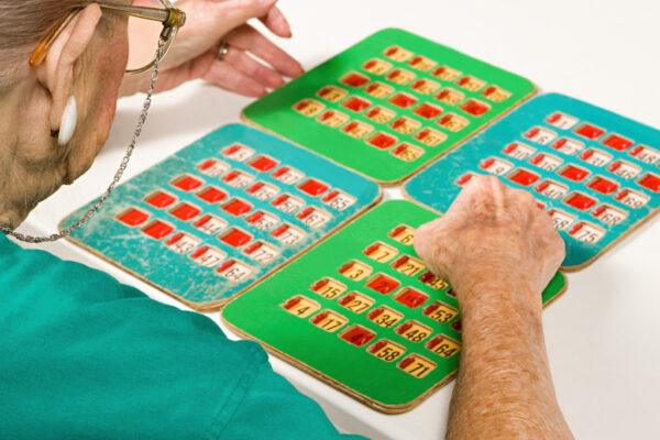 Person playing bingo with a group