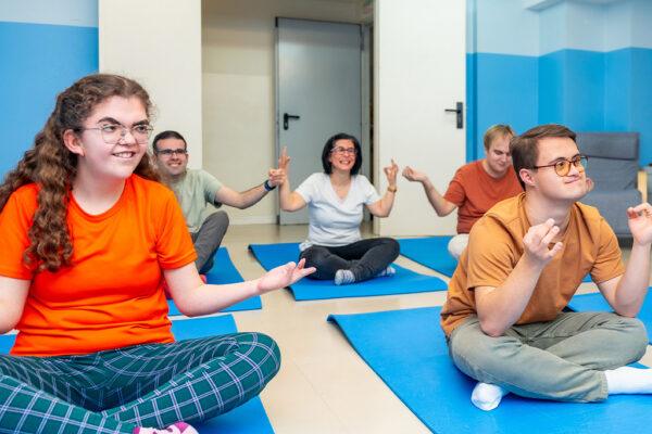 People participating in a yoga group session