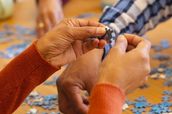 People participating in a hands-on puzzle activity